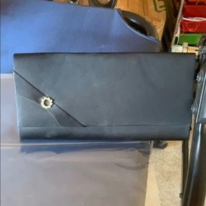 Black satin rhinestone embellished clutch.